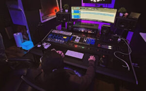 A recording studio at BQE Studios. Someone is recording and mixing audio